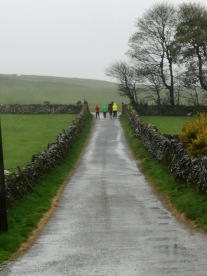 And we're off! Cheerfully battling wind and rain to follow the clues.
